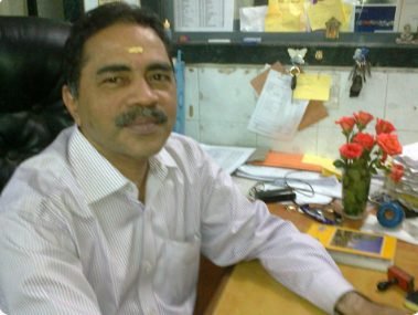 Dr. Rajendran Menon at the laboratory's reporting desk